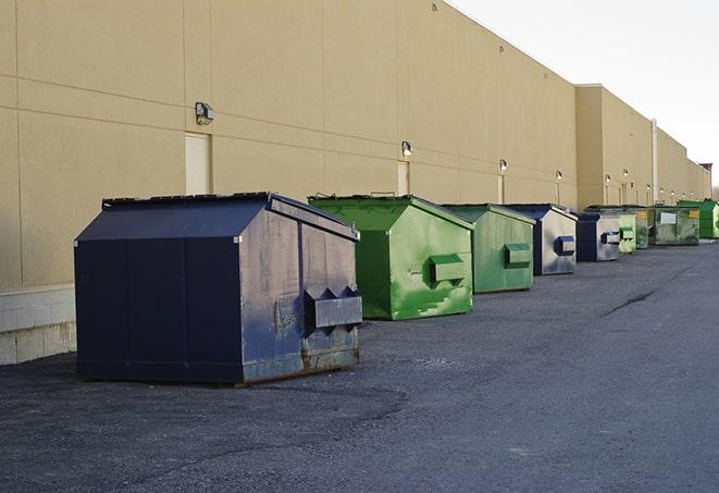 construction dumpsters on a worksite surrounded by caution tape in Decatur GA